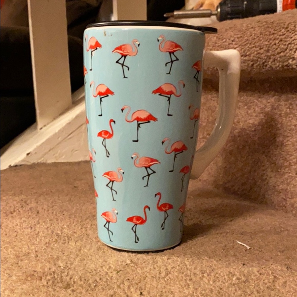 A flamingo travel mug